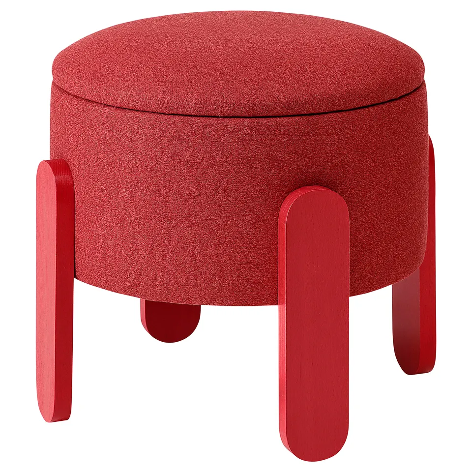 FÖRLUNDA red upholstered round ottoman with four wooden legs.