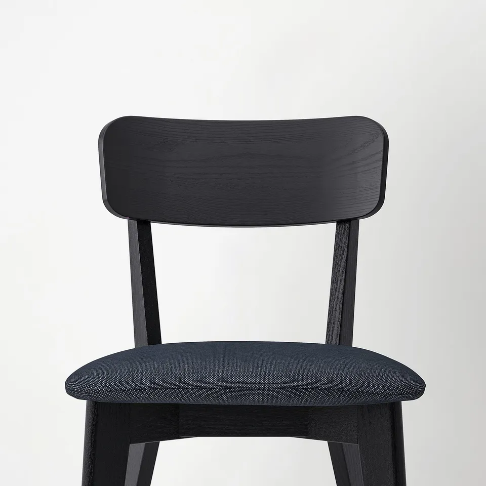 Modern black chair with cushioned seat; sleek, dark wood design. Ideal for contemporary spaces.