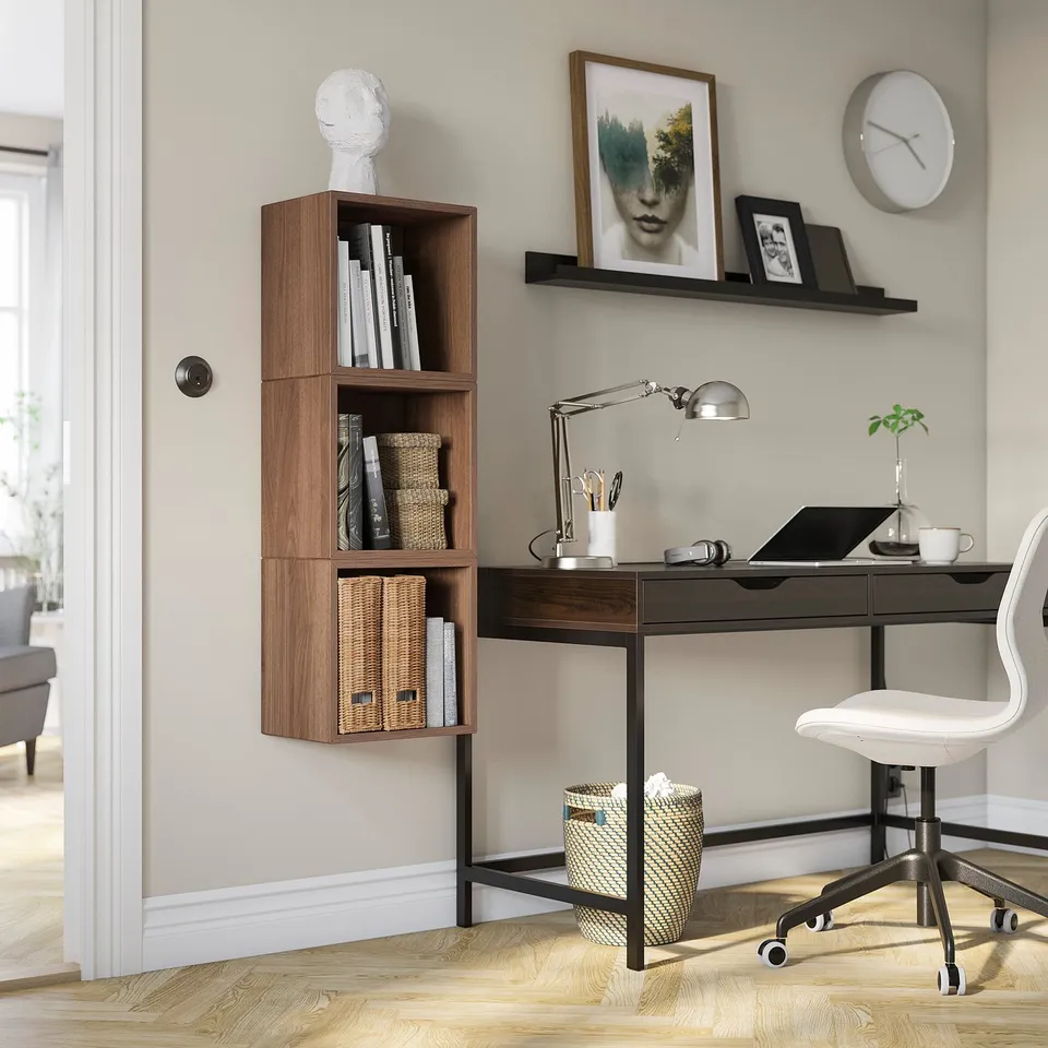 Home office with EKET storage, desk, lamp, laptop & chair.
