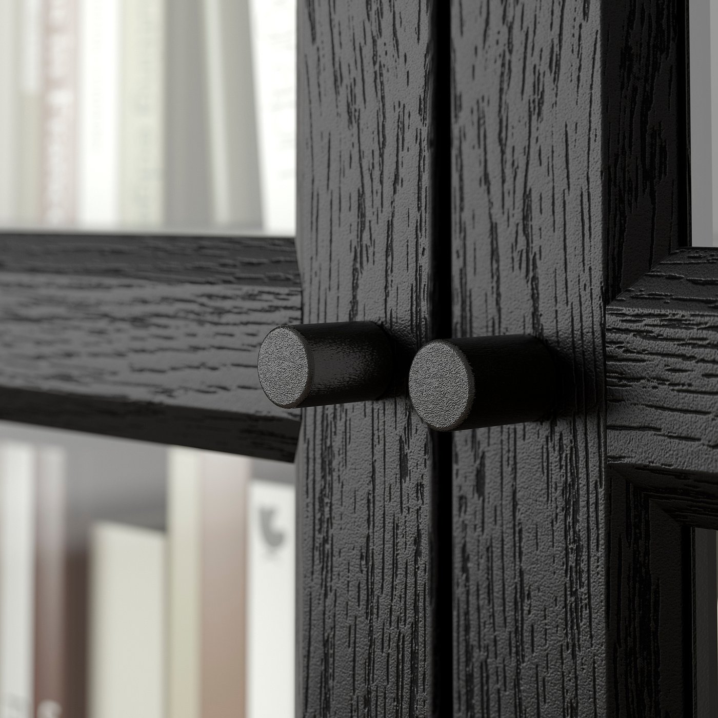 Black wooden door with cylindrical metal hinge, detailed texture, and smooth finish.