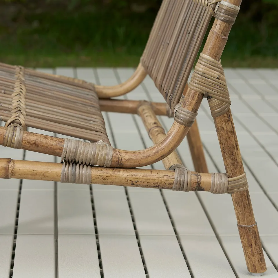 Handwoven rattan chair, natural & intricate design. Sturdy joints, outdoor-ready.