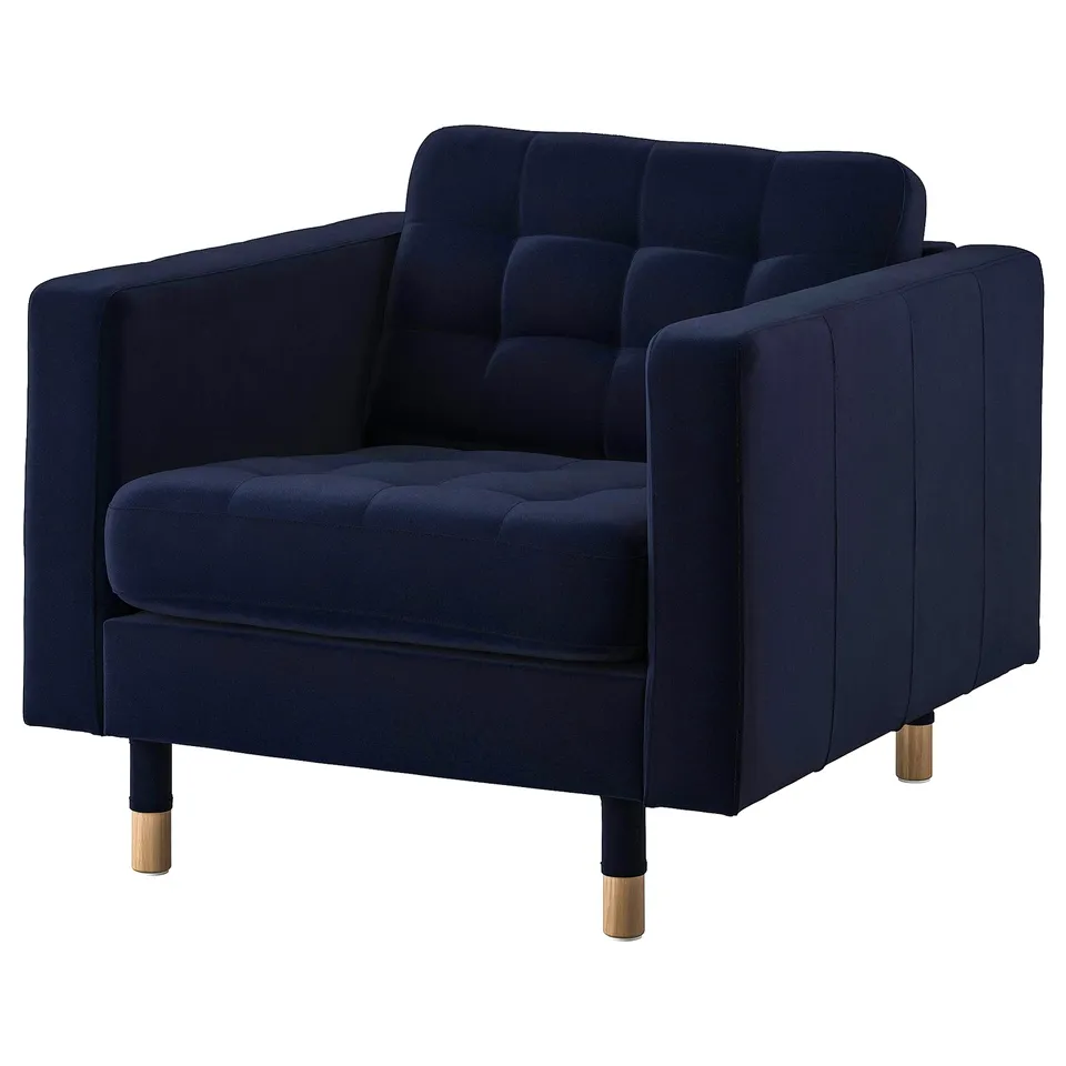 Blue velvet armchair, metal legs, deep cushions, modern style.