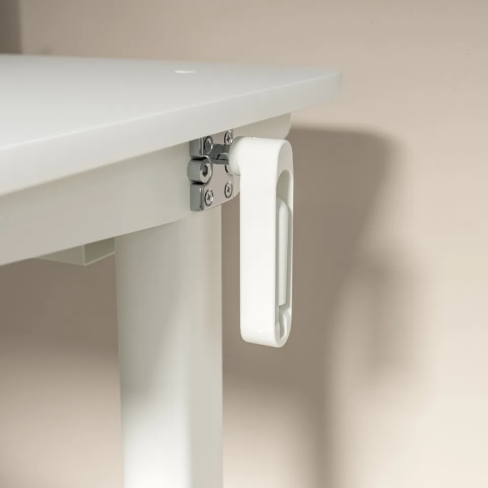 White desks underside, metal brackets, adjustable height crank.