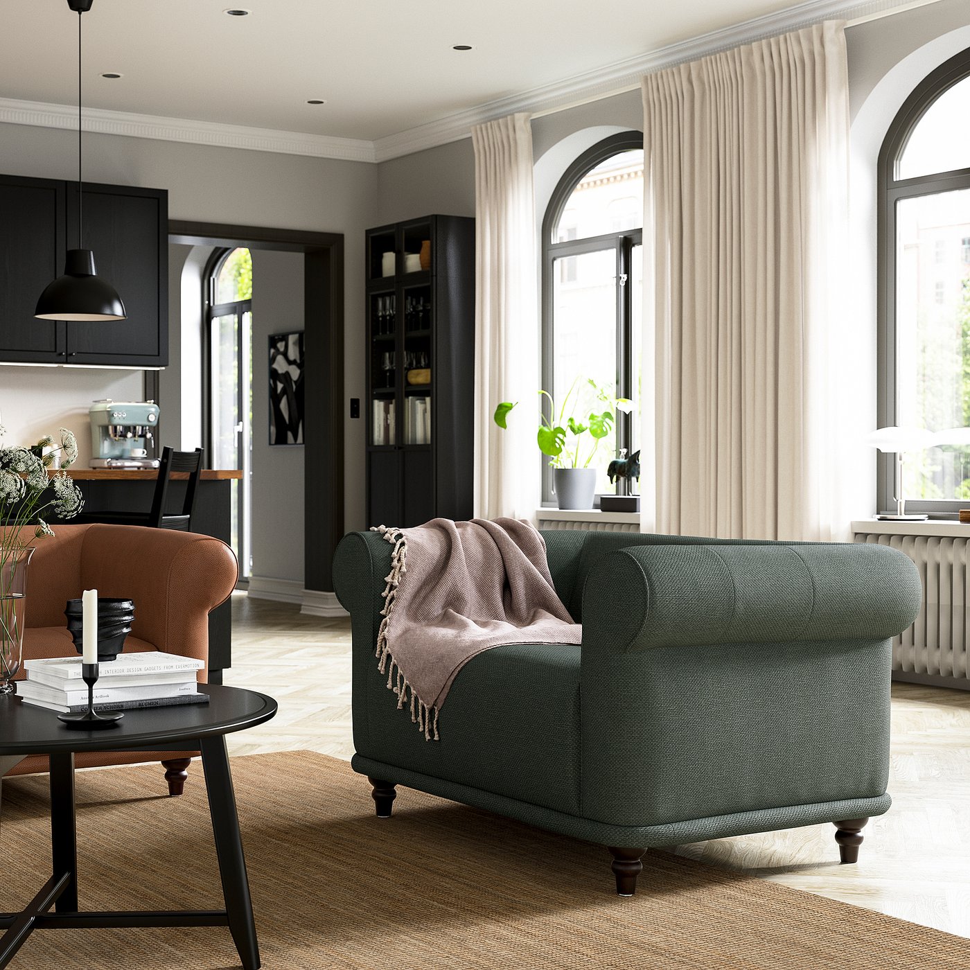 Modern living room with VISKAFORS green chair, brown armchair, black table, and large windows with curtains.