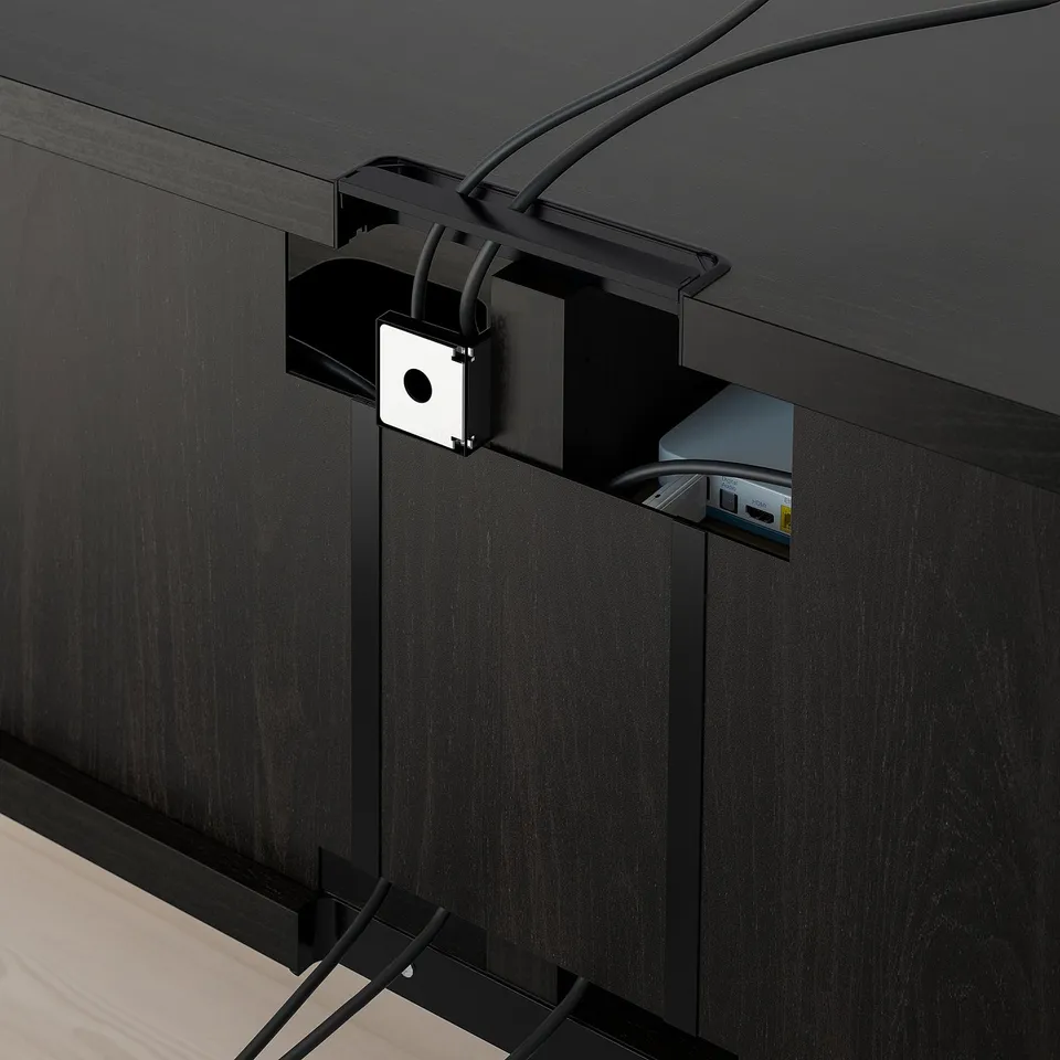 Black tv stand with built-in cable management, featuring cable outlet and adjustable drawer runners.