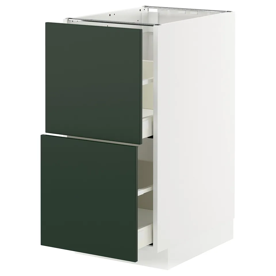 Modern white kitchen cabinet with two green drawers, sleek design.