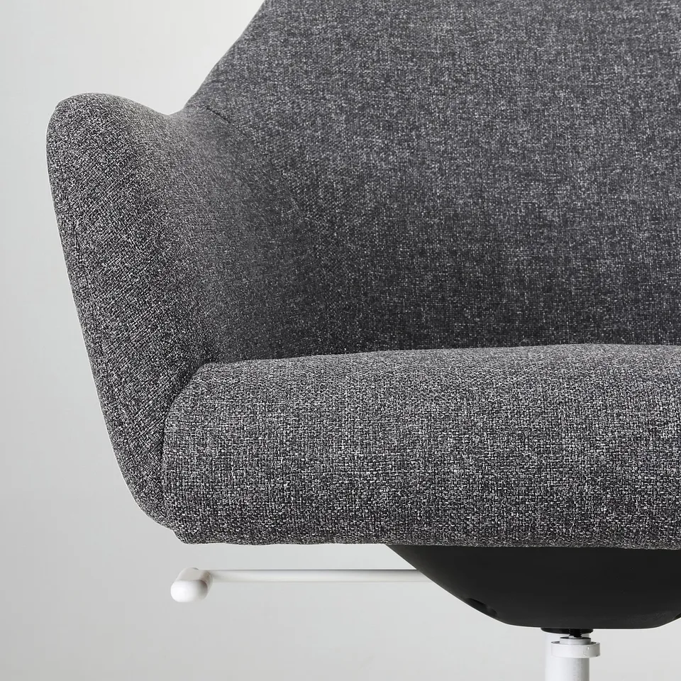 Close-up of a modern, cushioned office chair, showcasing its soft padding and durable fabric.