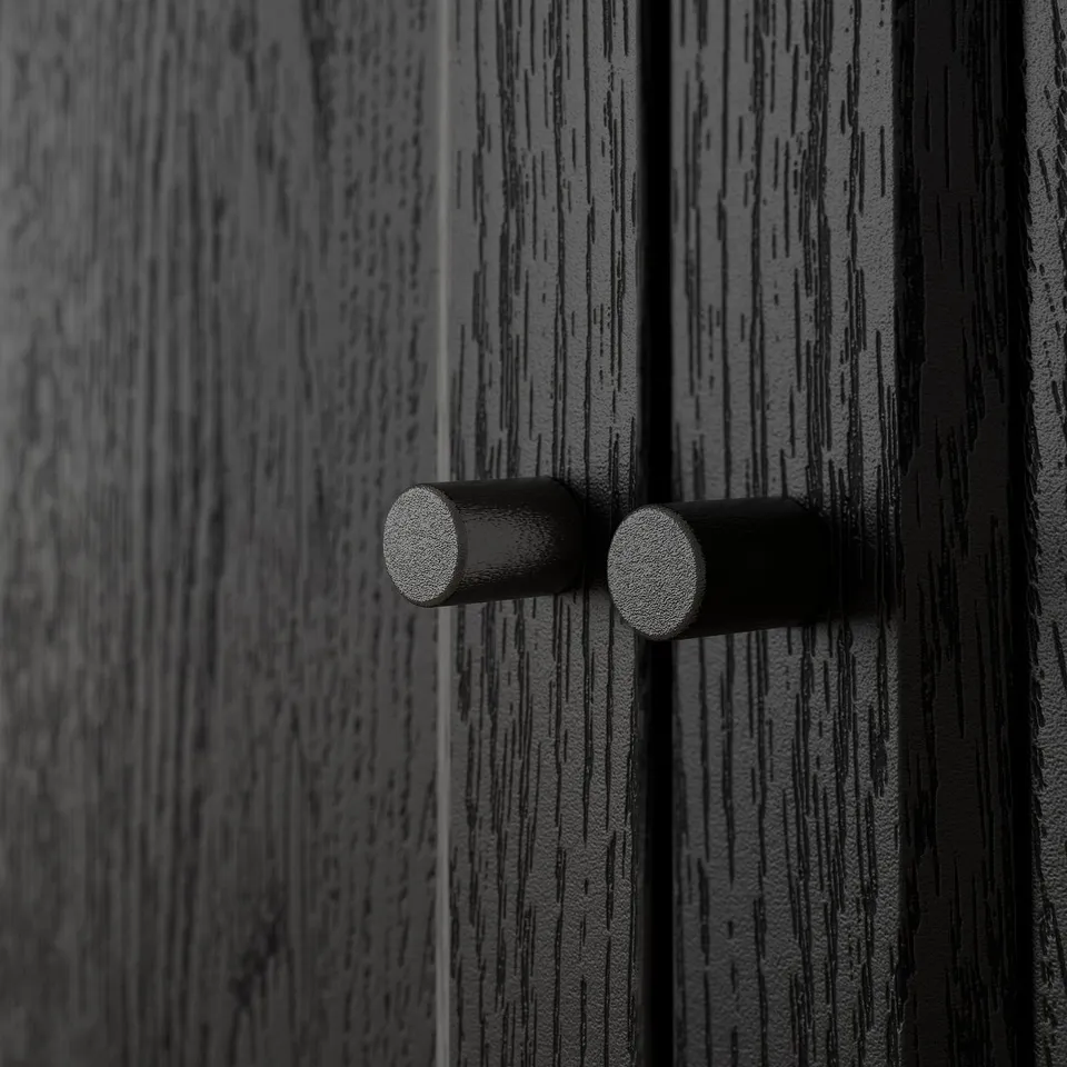 Close-up of black door hinges on wooden surface. Durability and modern design.