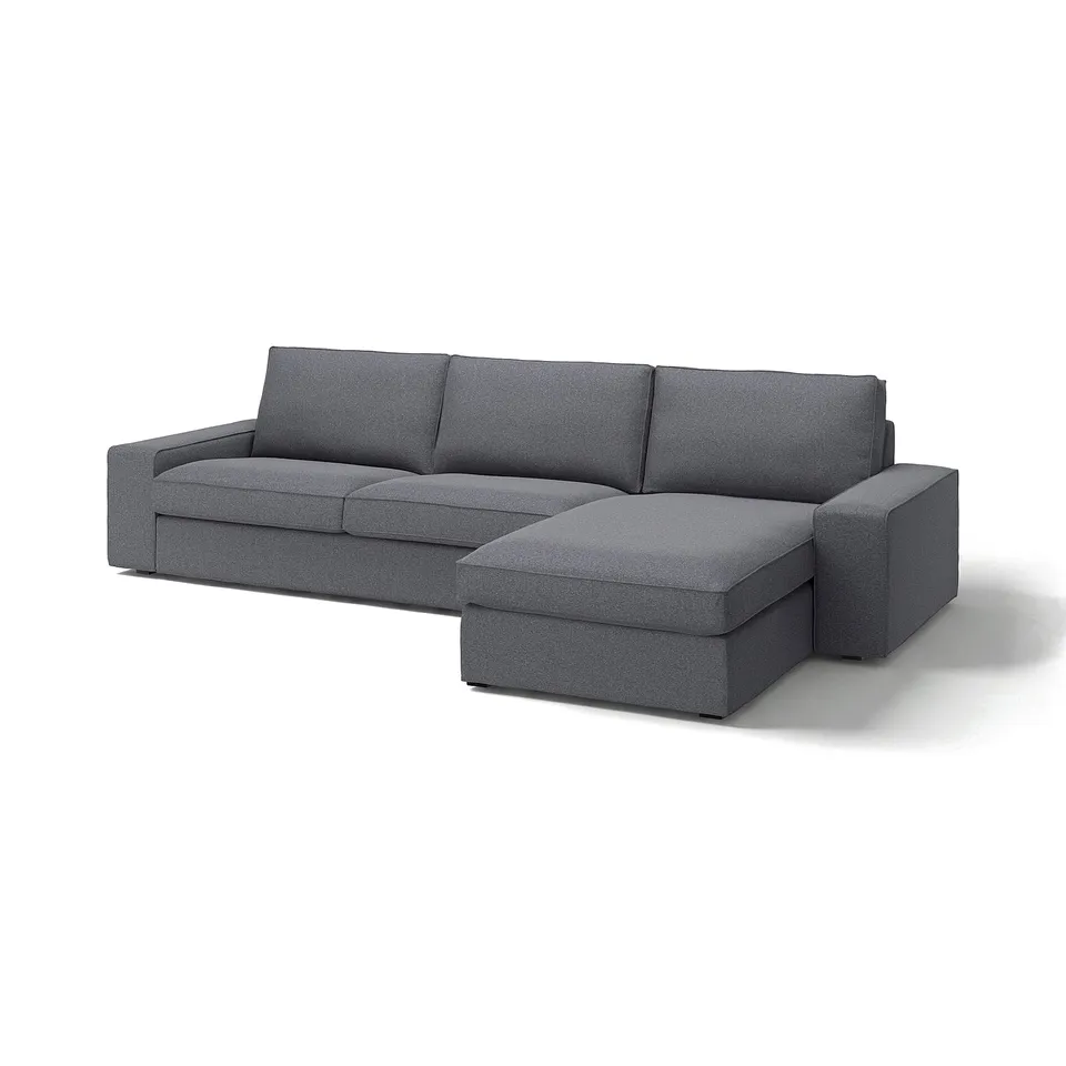 The KIVIK sectional sofa is grey, l-shaped, with deep cushions and removable armrests, designed for comfort and relaxation.