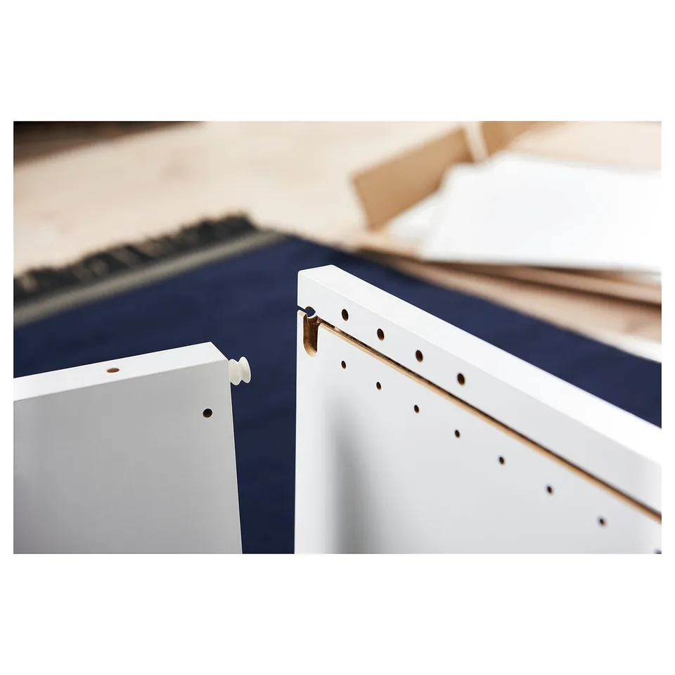 White PLATSA storage unit corner assembly close-up.
