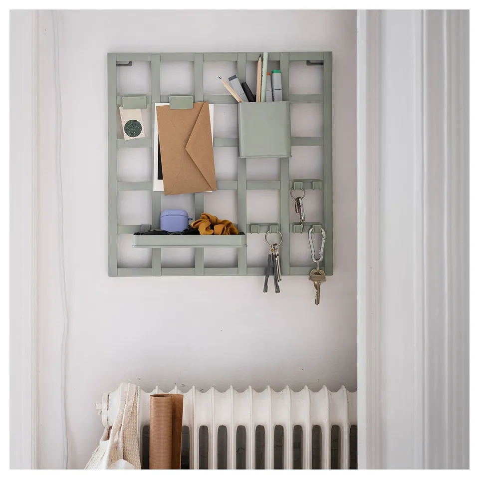 SNICKRA storage board in green with shelf, clips, hooks, and keys.