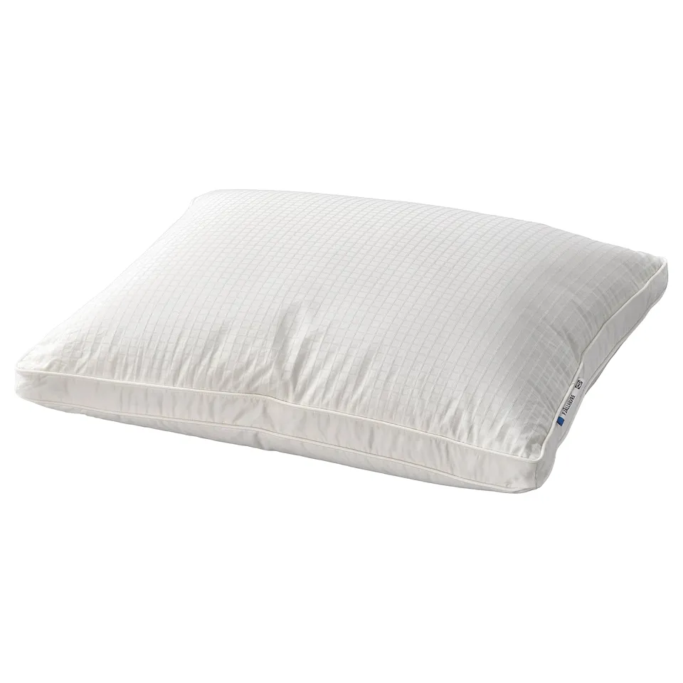 A white fjällräven FJÄLLHAVRE pillow. It has a rectangular shape with double-stitched edges and is filled with recycled down and feathers for comfort.