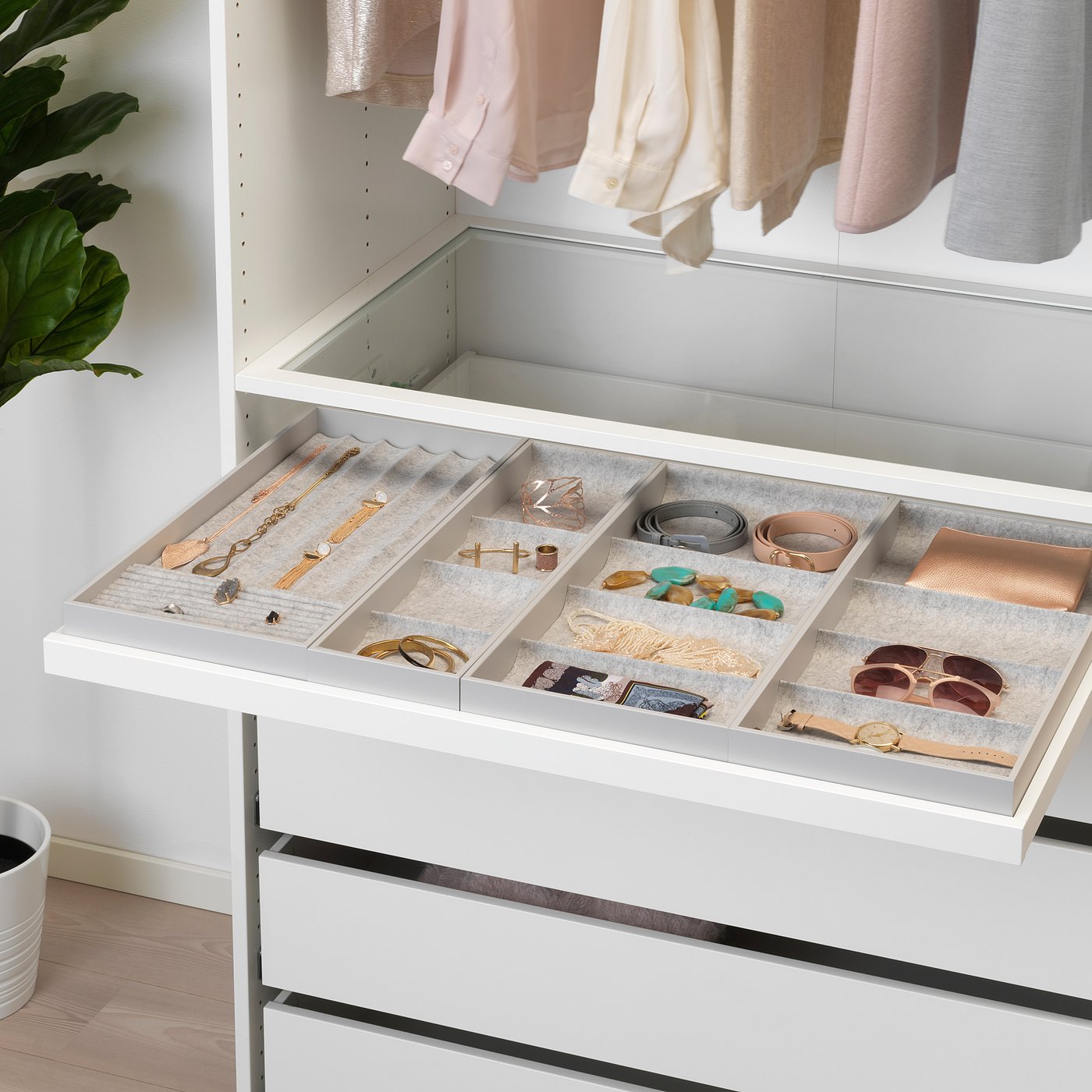 Open drawer with compartments holding jewellery and accessories, featuring KOMPLEMENT insert for organised storage.