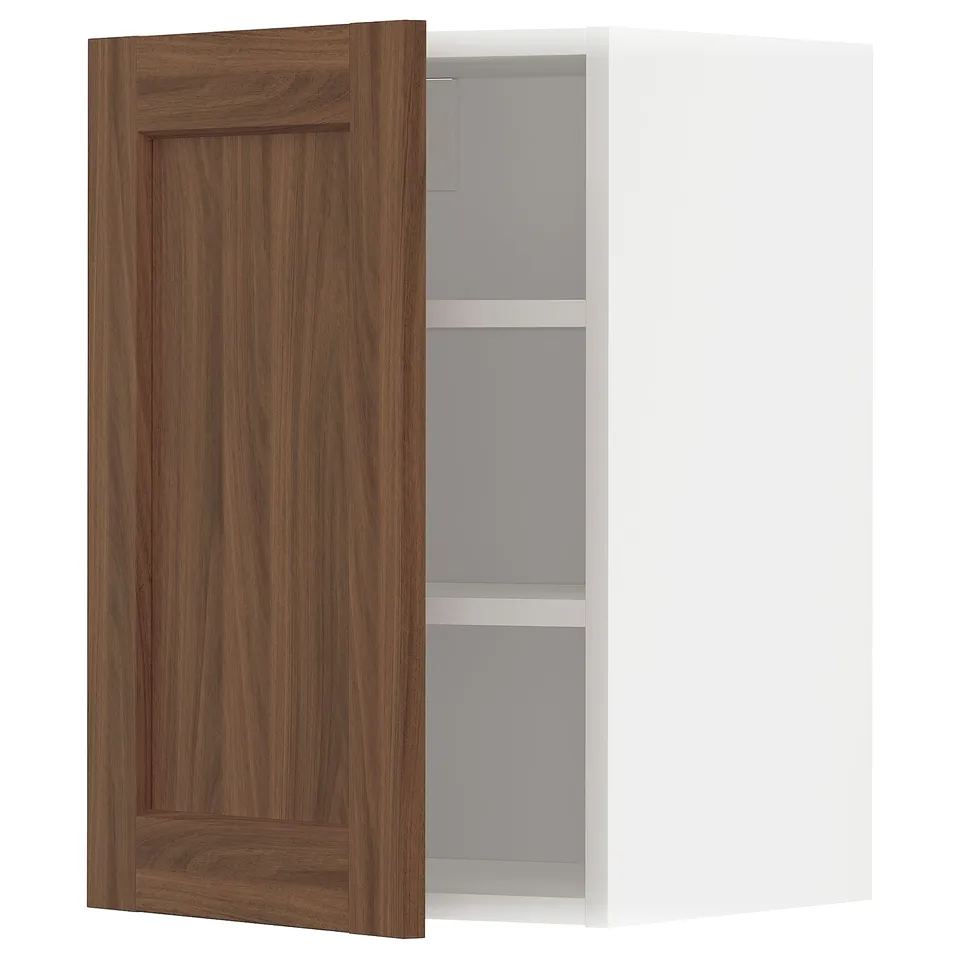 Walnut-colored kitchen cabinet with two shelves, door slightly open.