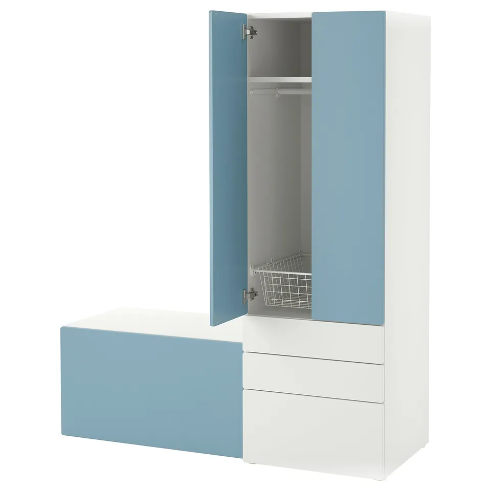 A blue and white SMÅSTAD storage unit. It a tall wardrobe with drawers and an open door revealing shelves and a rail.