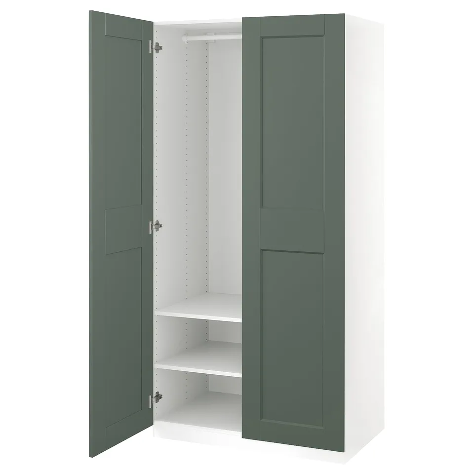 PAX wardrobe in green-white, open doors, white shelves.