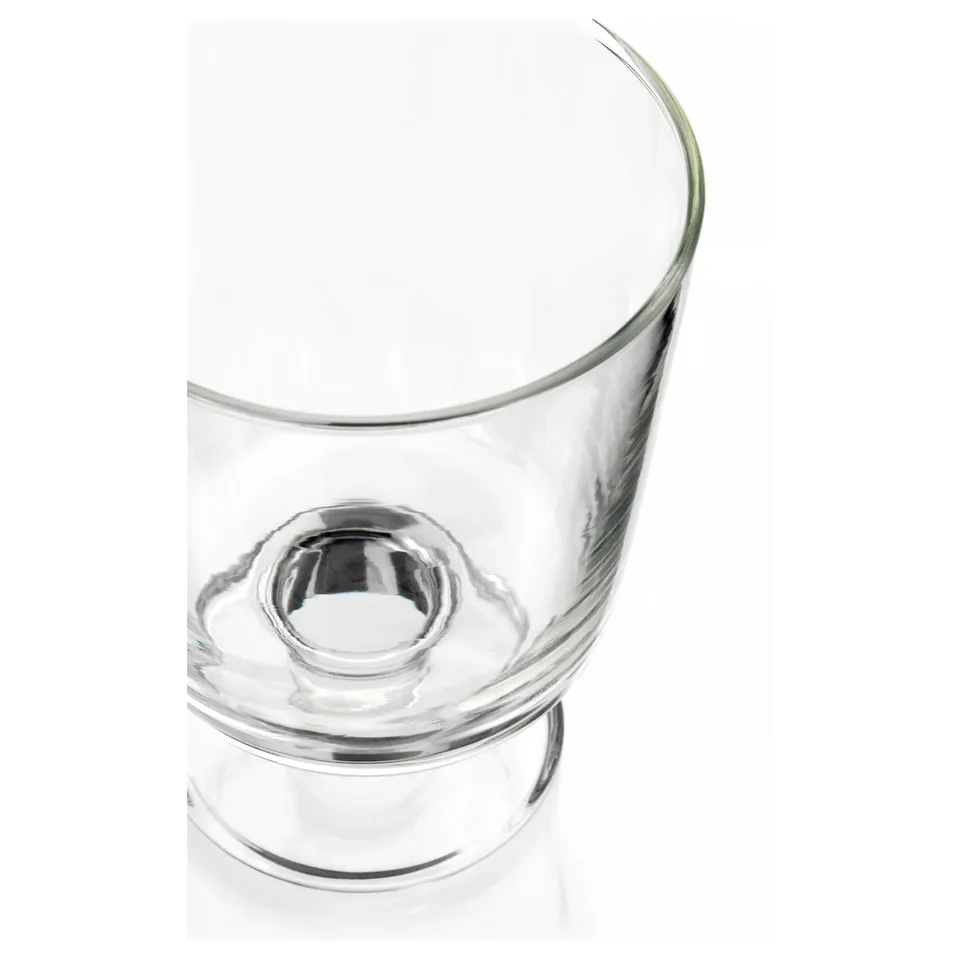 Clear glass cup with a wide, angled rim and a round, smooth base. Elegant and simple design, reflecting light for a sleek, modern look.