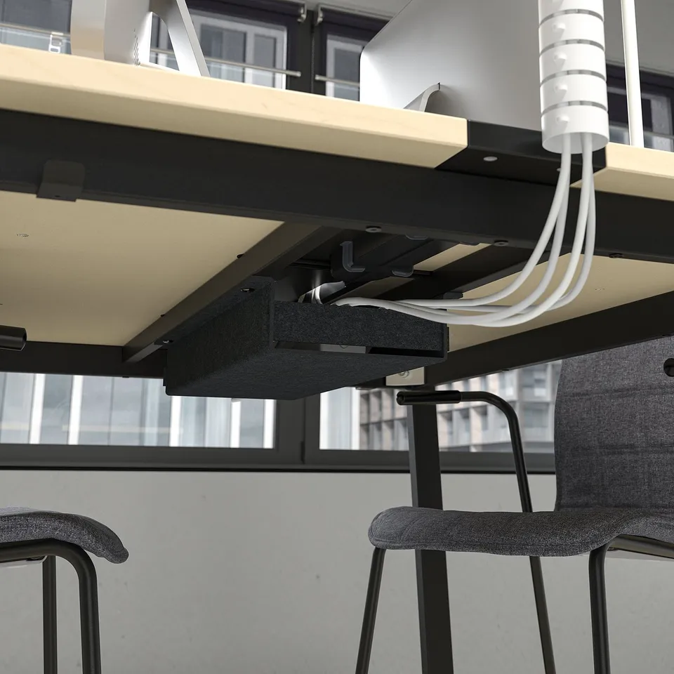 Underside view of MITTZON conference table with built-in cable management system, showcasing wires neatly organised and ready for use.