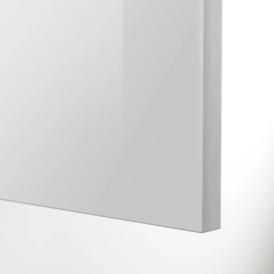 A sleek, high-gloss grey kitchen cabinet door with a smooth, reflective finish, part of the METOD kitchen system.