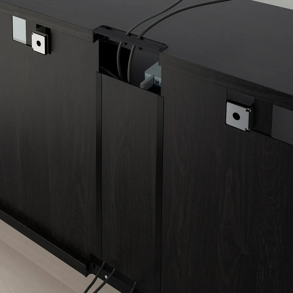 Black tv unit with adjustable shelves, cable management, and soft-close drawers.