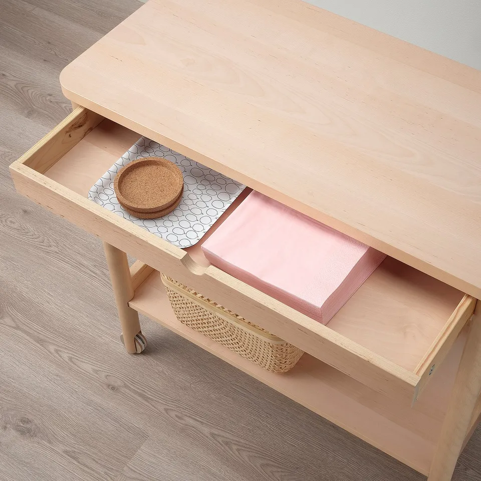 Wooden trolley with drawer and lower shelf. Holds basket, tray, and box for storage.