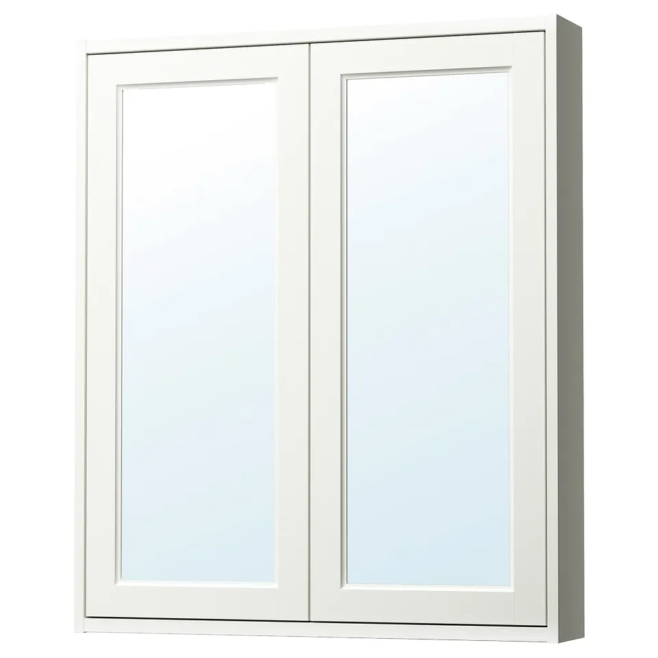 A TÄNNFORSEN white mirror cabinet with bevelled panels, offering storage and reflecting light to enhance bathroom space.
