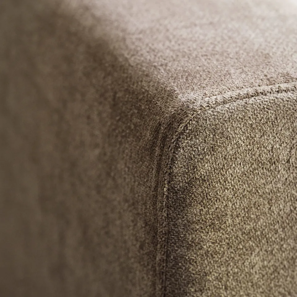 Close-up of UPPÅKRA sofa fabric, soft texture & subtle sheen, showcasing quality comfort.