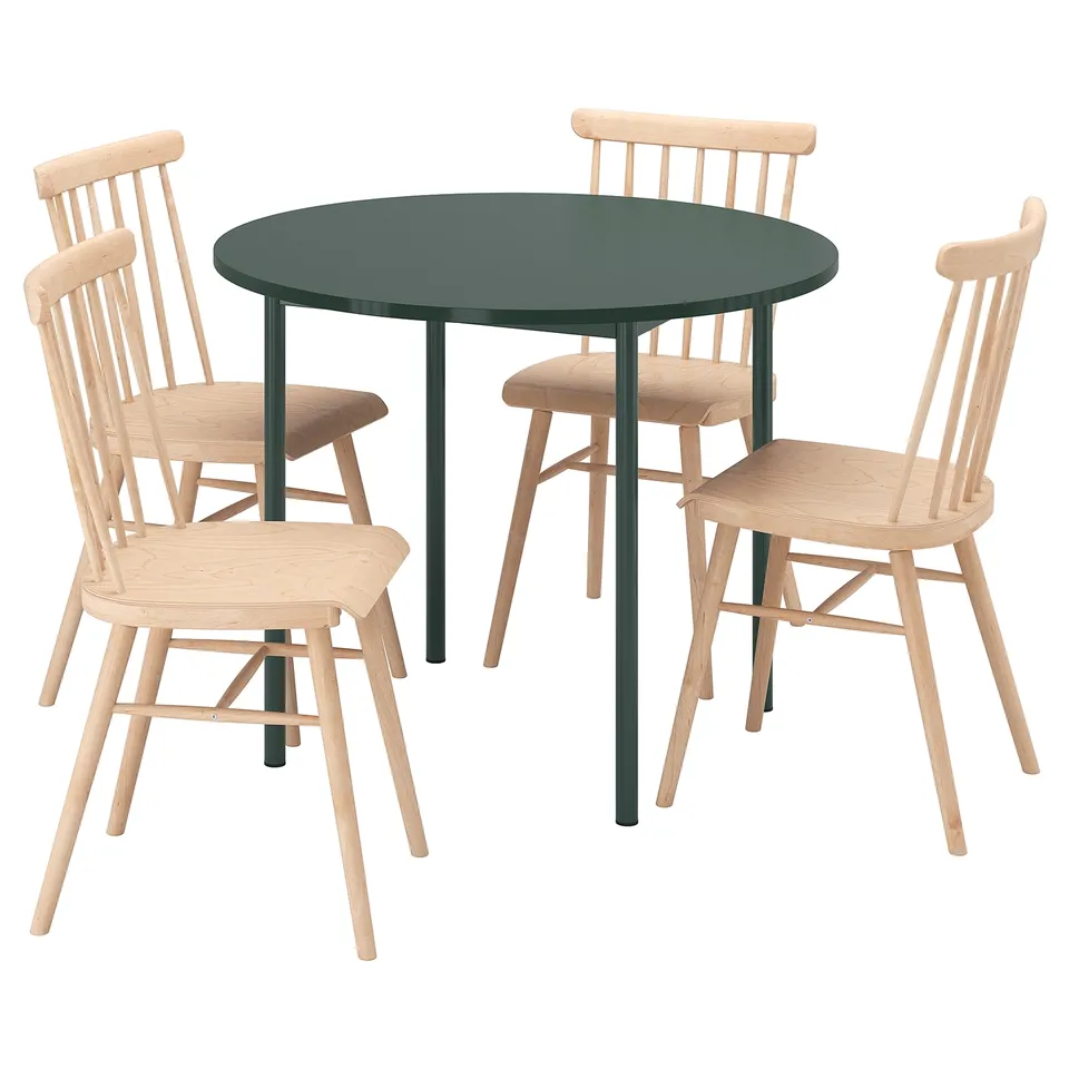IKEA PS 2026 dining set: round green table, four light wood chairs with spindles, modern classic design.