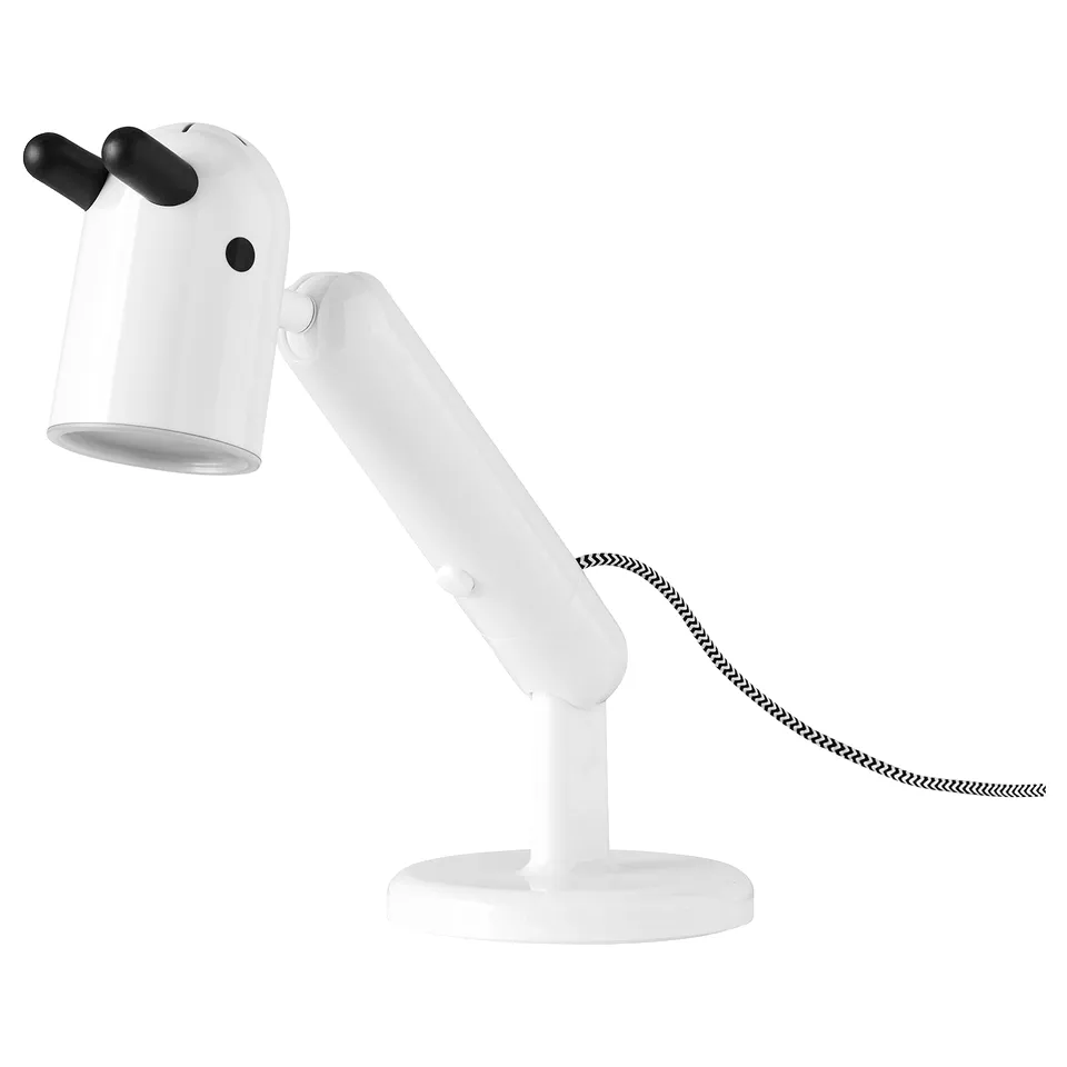 KRUX adjustable desk lamp with black handle and cord for task lighting.