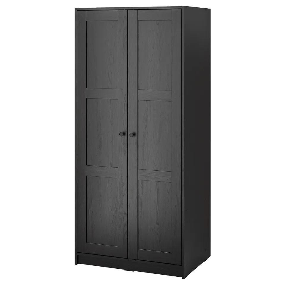 A tall, dark grey RAKKESTAD wardrobe with two doors, made of fiberboard and particleboard, standing upright against a white background.