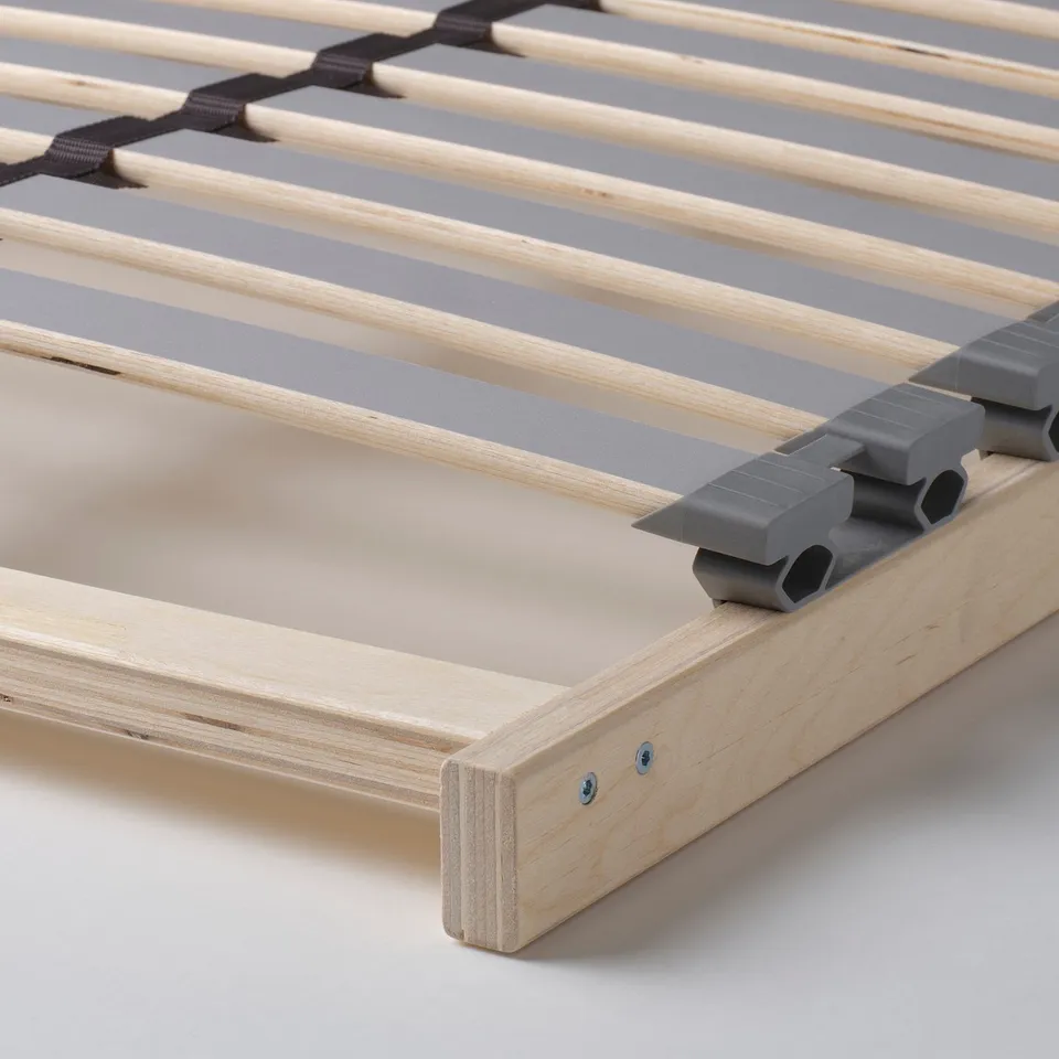Wooden bed base with adjustable slats; modern, durable, supportive design.