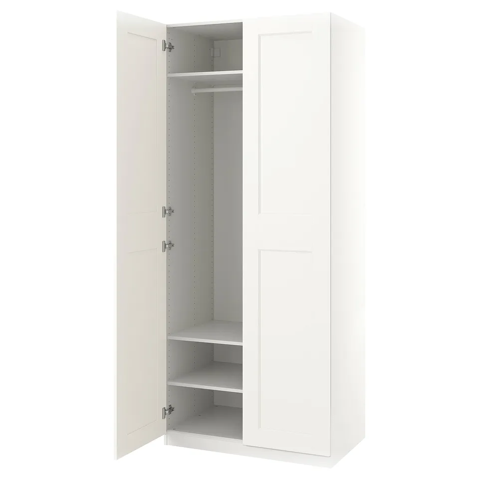 White PAX wardrobe; slim, modern; open doors reveal inner shelves & rail; neat design.
