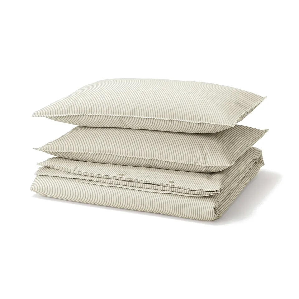 Stack of light beige and white striped cotton pillows, neatly folded.