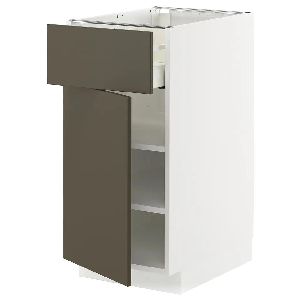 A white METOD kitchen cabinet with a dark brown drawer and shelf.