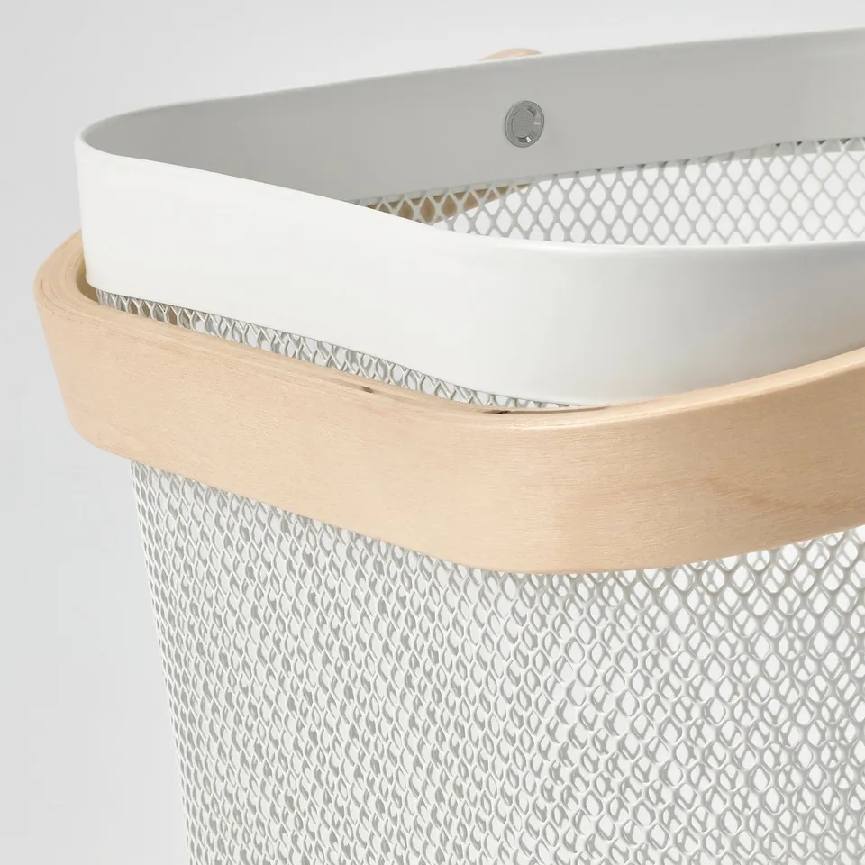 A stylish RISATORP storage basket with a wooden handle and metal mesh design, highlighting its sturdy and modern construction.
