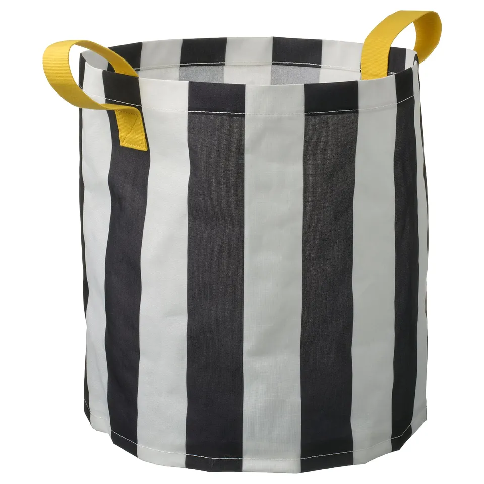 Black and white striped storage bag with yellow handles.
