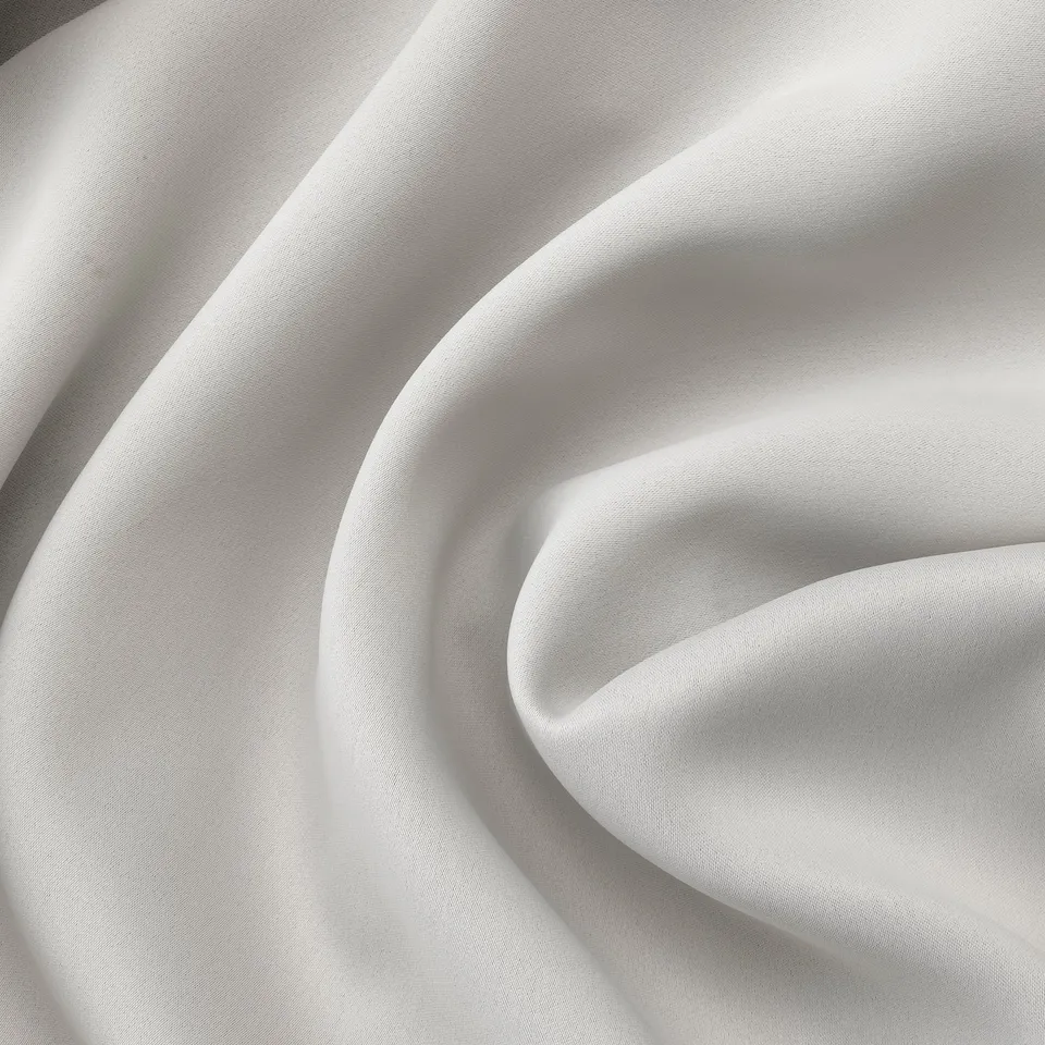 Close-up of high-quality, textured, white curtains, showcasing their smooth,.
