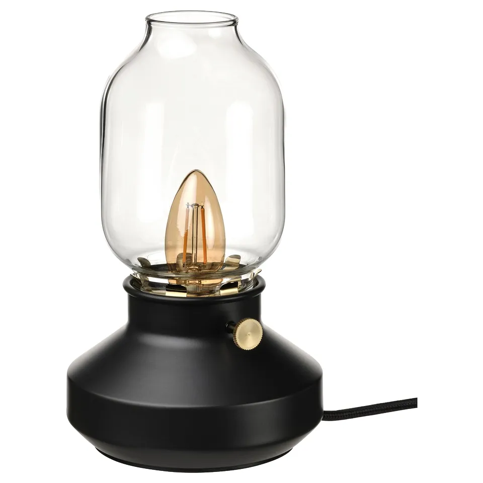 Black vintage-style lamp with glass shade & visible bulb.
