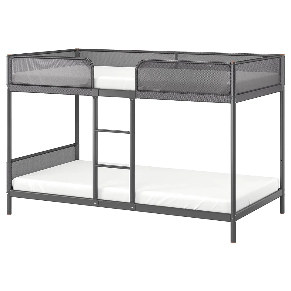 A grey metal TUFFING bunk bed with a ladder, white mattresses, and mesh safety guardrails.