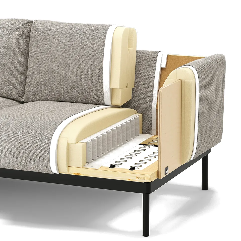Modern sofa with exposed innards showcasing materials like polyester fabric, polyurethane foam, and steel springs on a steel and wood frame.