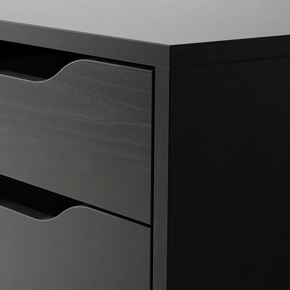 Black ALEX drawer unit, close-up. Sleek design, cut-out handles, and smooth surface.