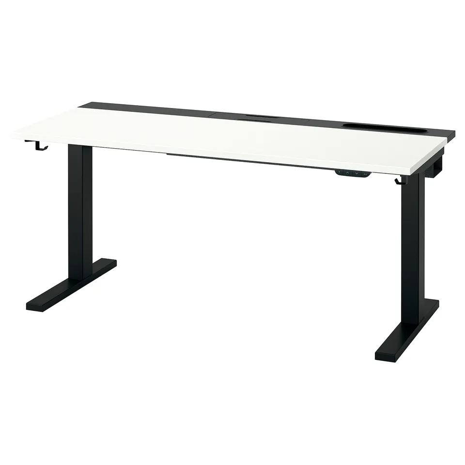 A MITTZON sit-stand desk with a white top and black base, offering ergonomic support and adjustable height for comfort.