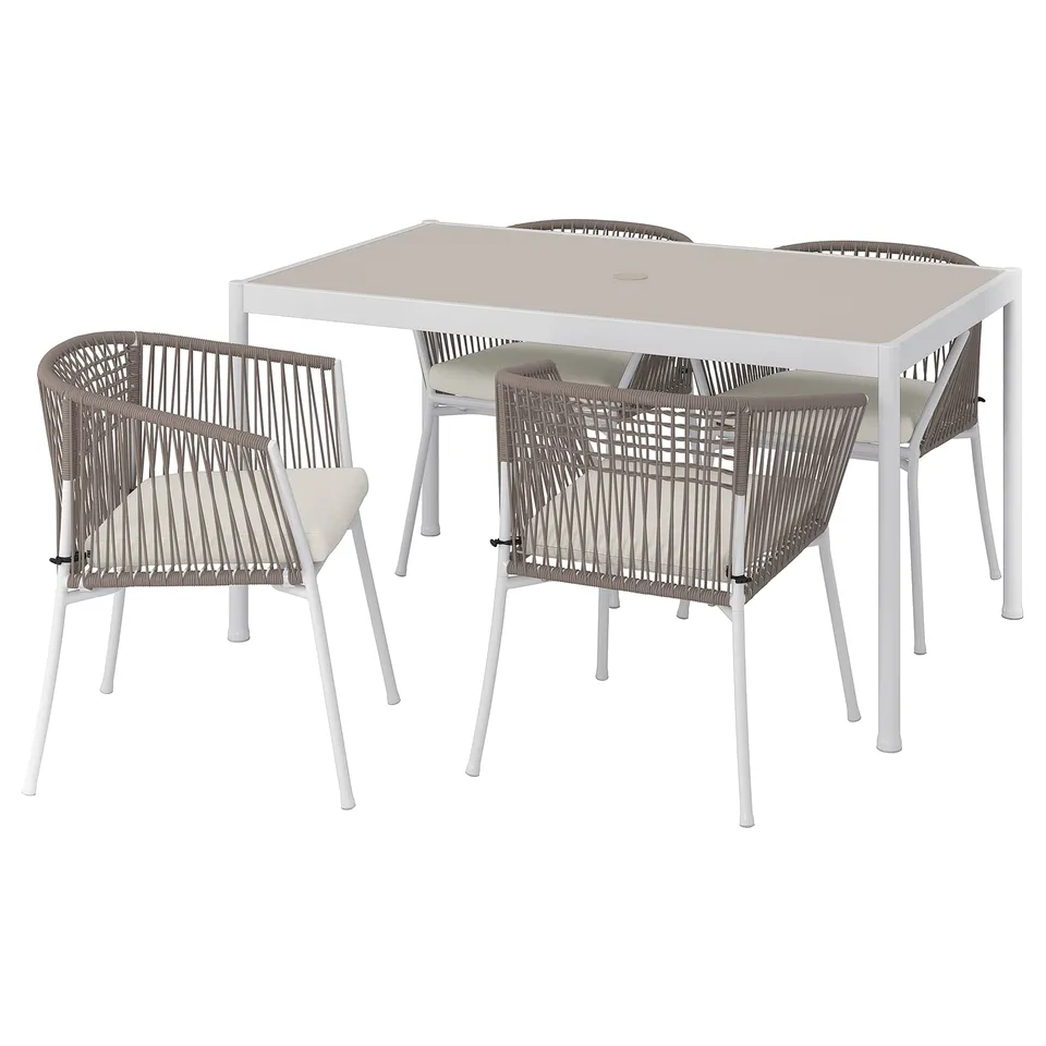 Modern outdoor dining set with square table, four wicker chairs, light beige cushions, light grey frames; ideal for balconies.