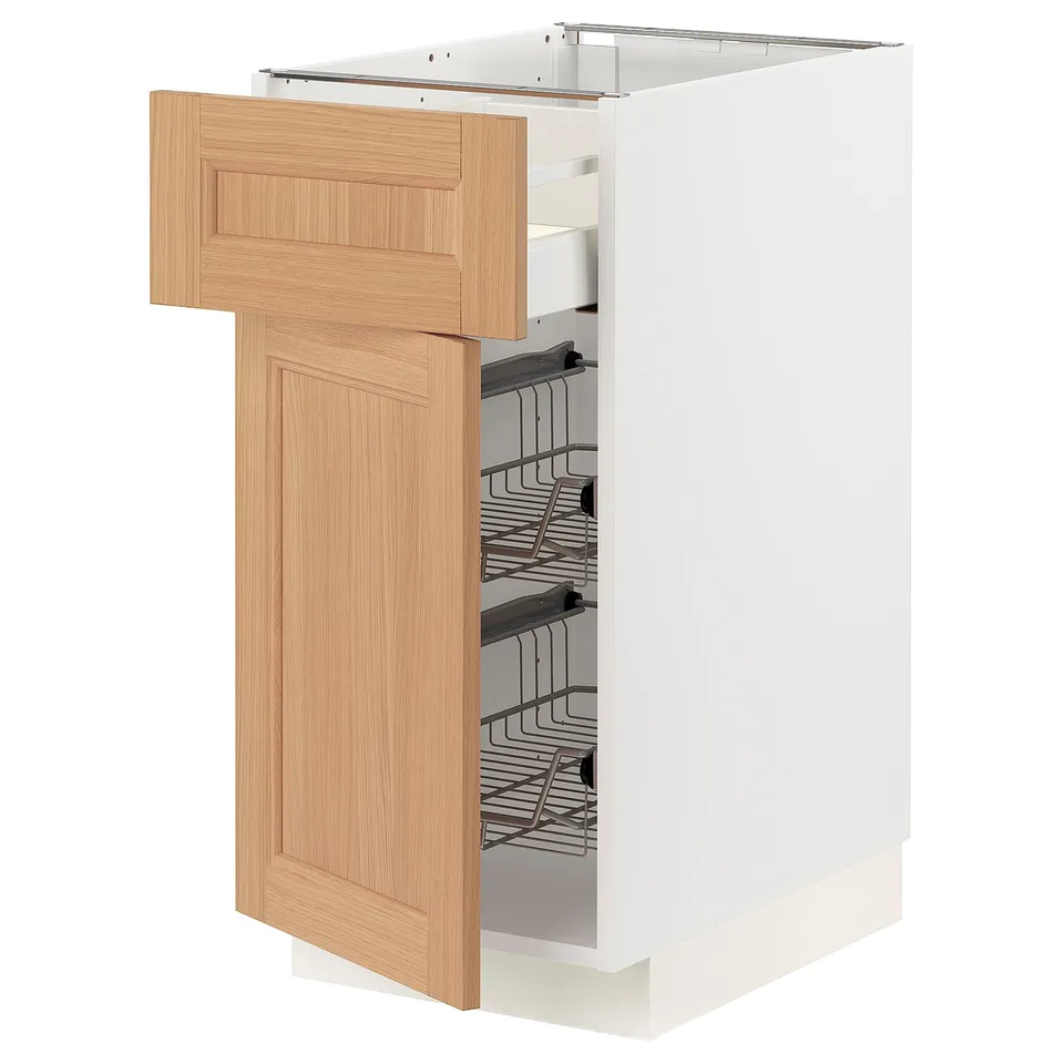 A white METOD kitchen cabinet with oak doors and wire baskets inside.
