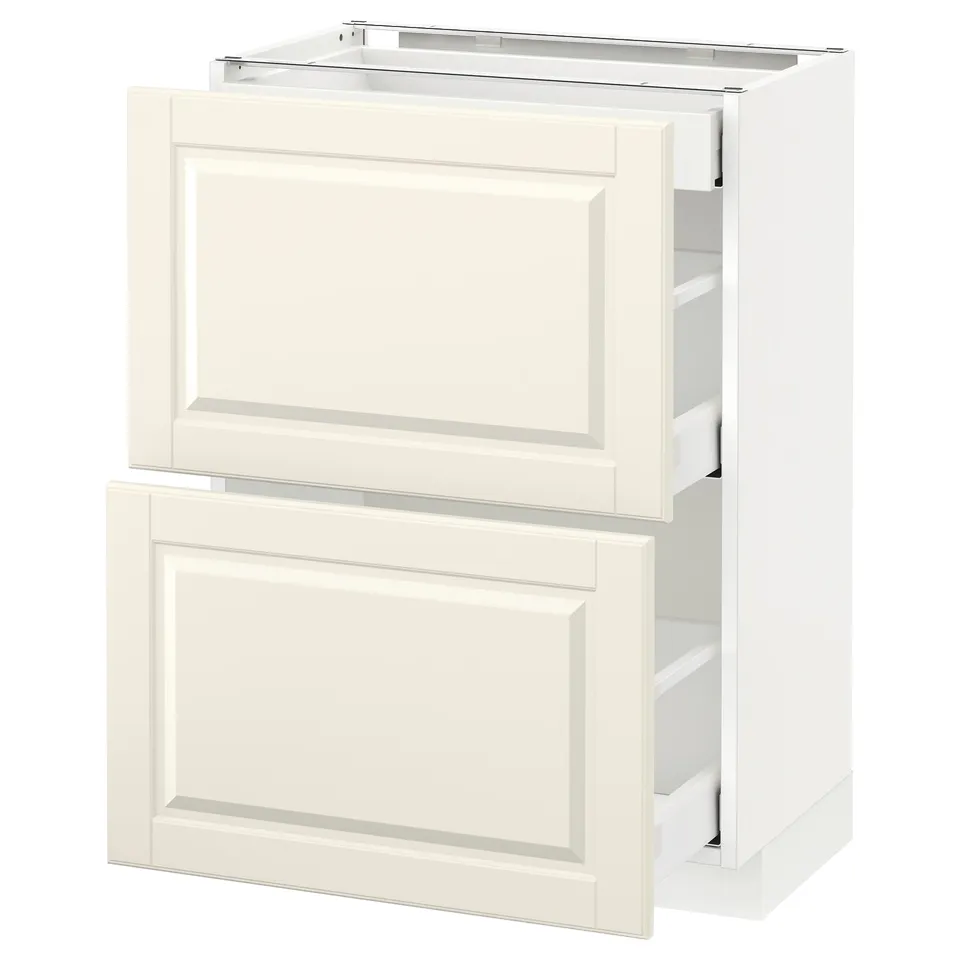 A white METOD kitchen cabinet with off-white bodbyn fronts, featuring bevelled edges and smooth-running drawers.