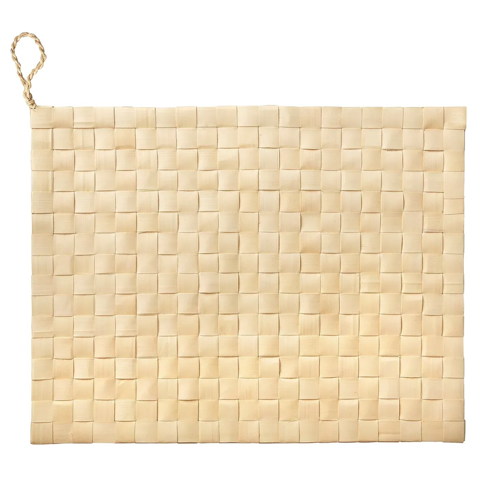 Handwoven MÄVINN beige place mat of palm leaf with loop. Rectangular, chequered design.