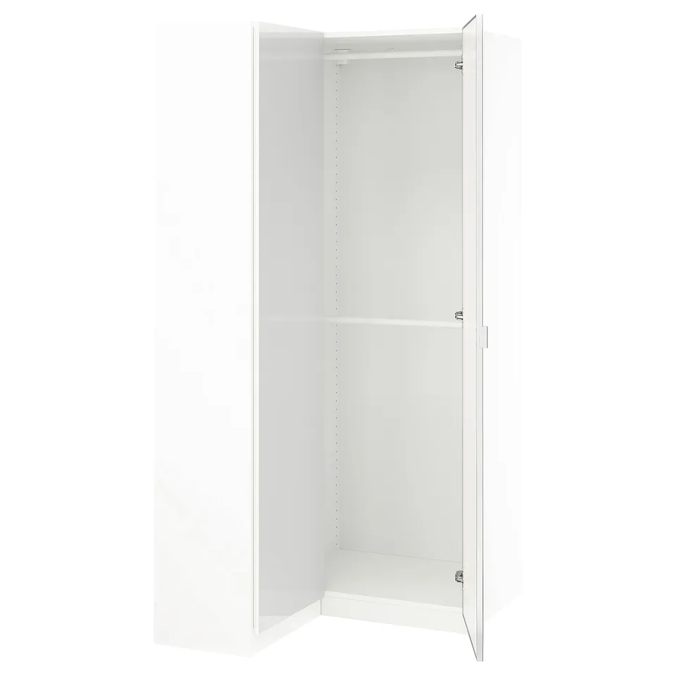 An open white PAX wardrobe with mirrored doors and multiple shelves inside.