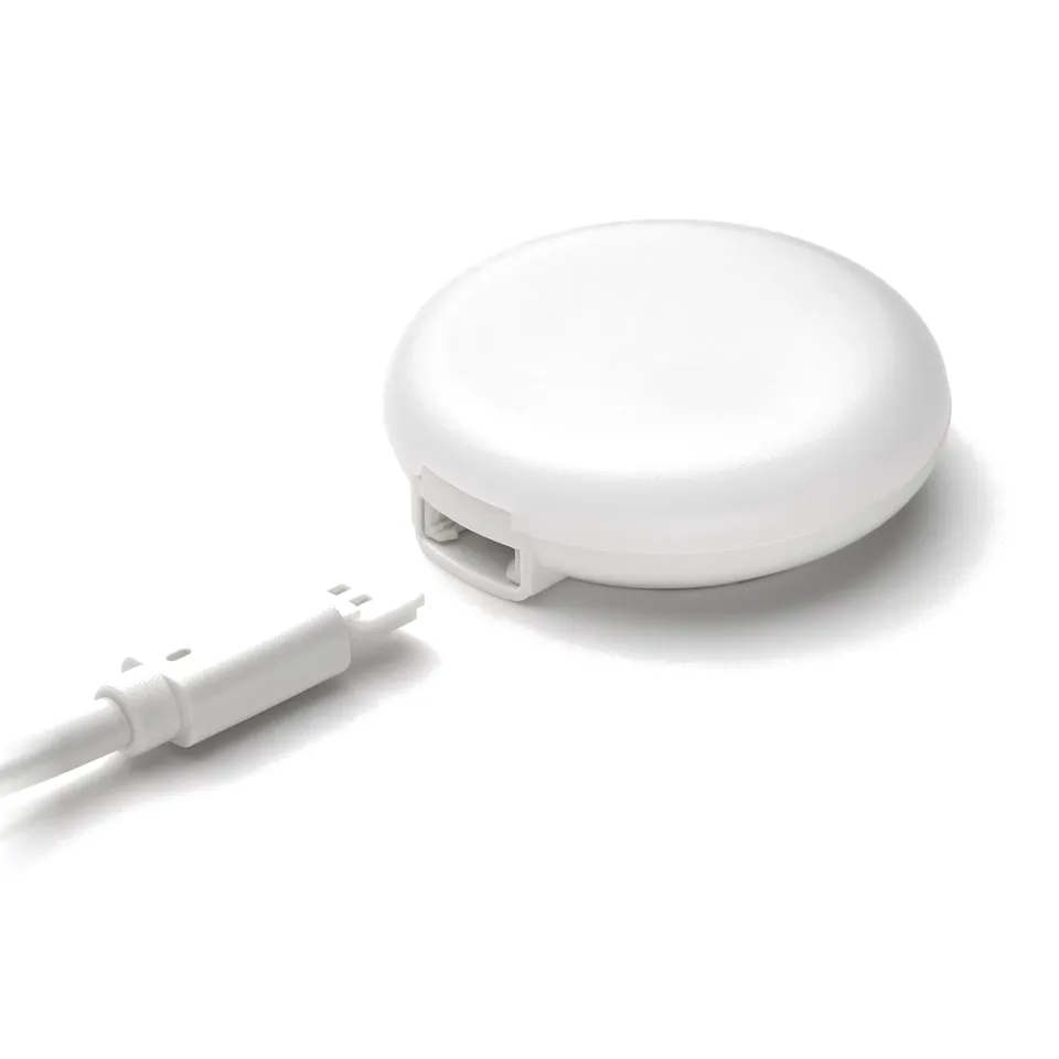 A sleek, white KAPPLAKE spotlight with a flexible cable attached, showcasing modern design and quality materials.