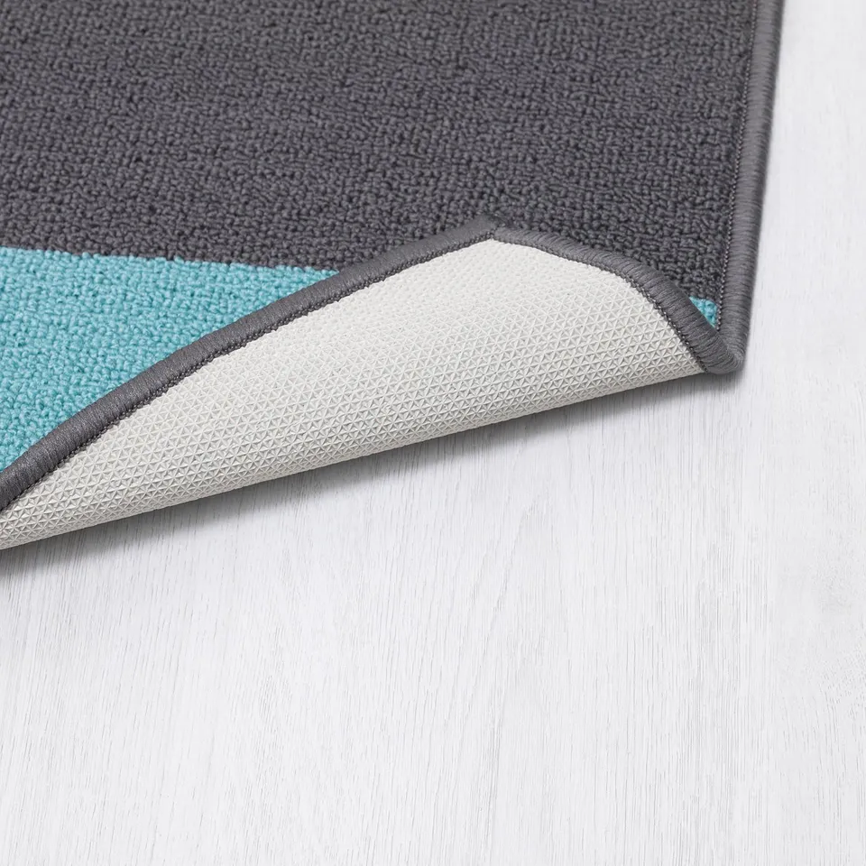 Grey and blue door mat with textured backing. Durable synthetic rubber and polypropylene.