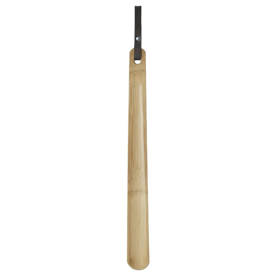 A natural bamboo HÖSVANS shoehorn with a leather handle, designed for durability and style.